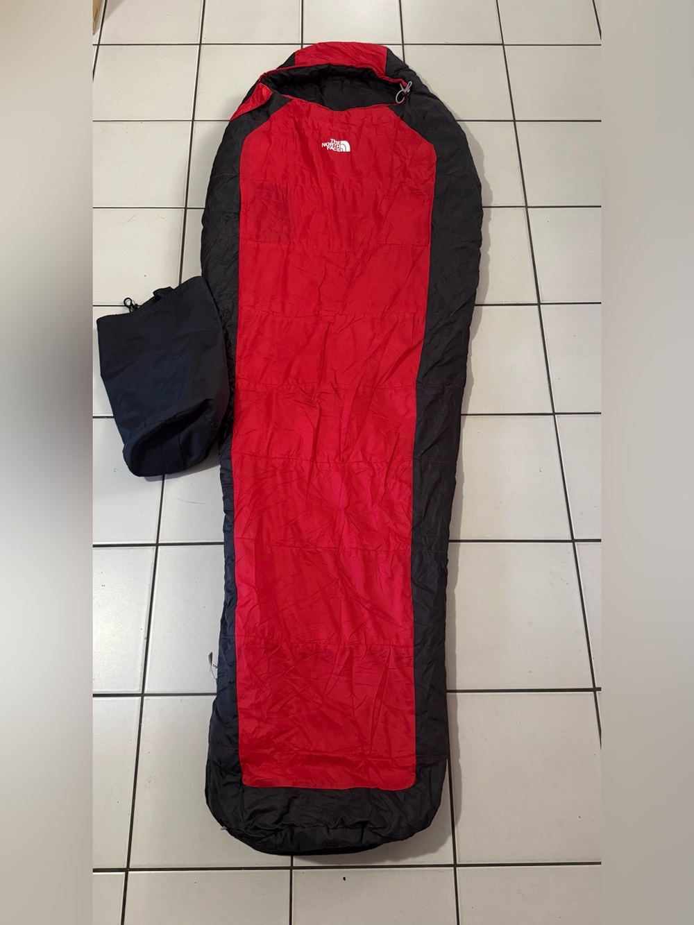 The North Face Red and Black Mummy-Style Sleeping Bag